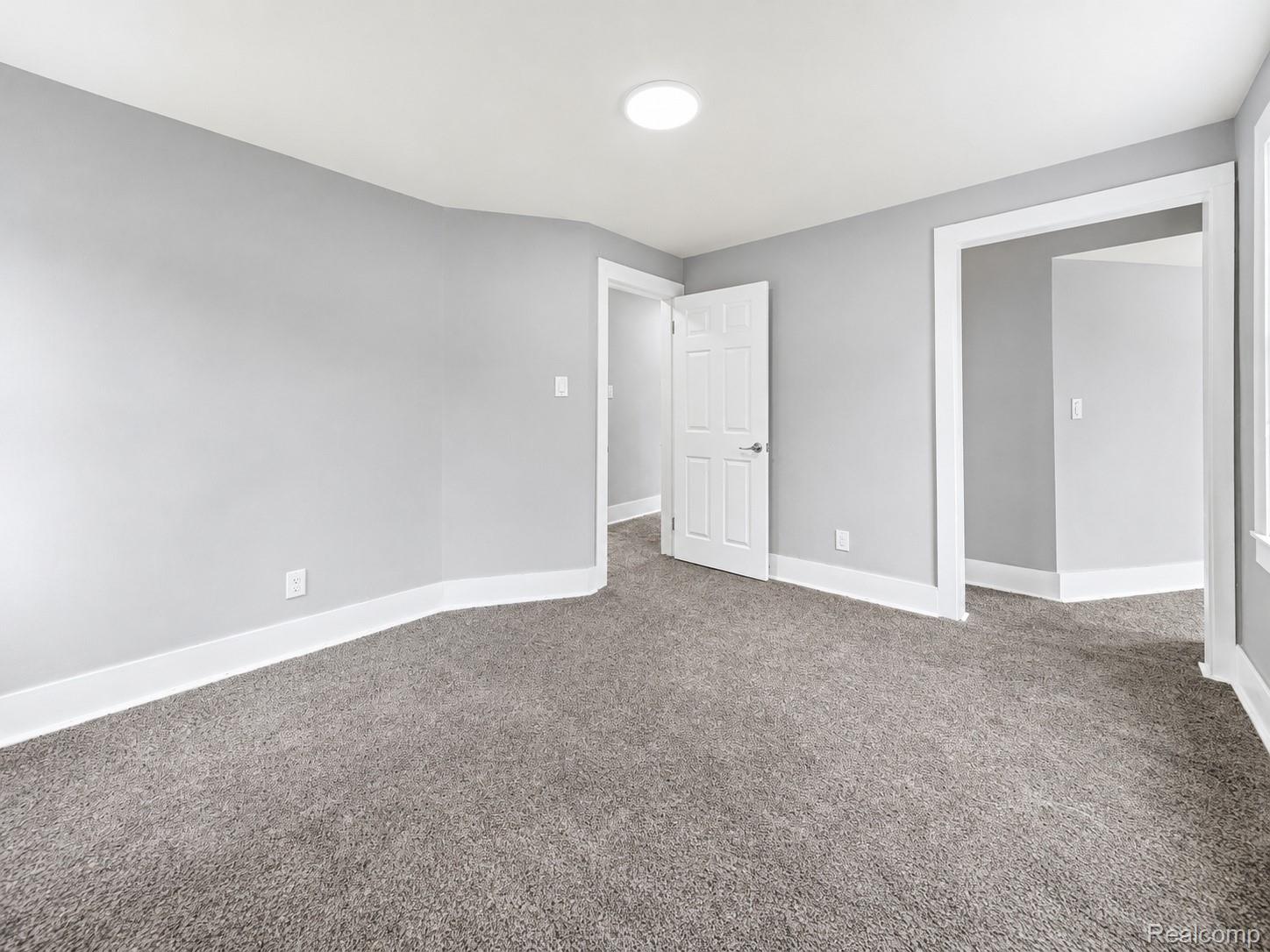 9175 Devonshire Road Detroit, MI 48224 - Photo 18 of 23 Interior room featuring new carpet flooring and light gray painted walls
