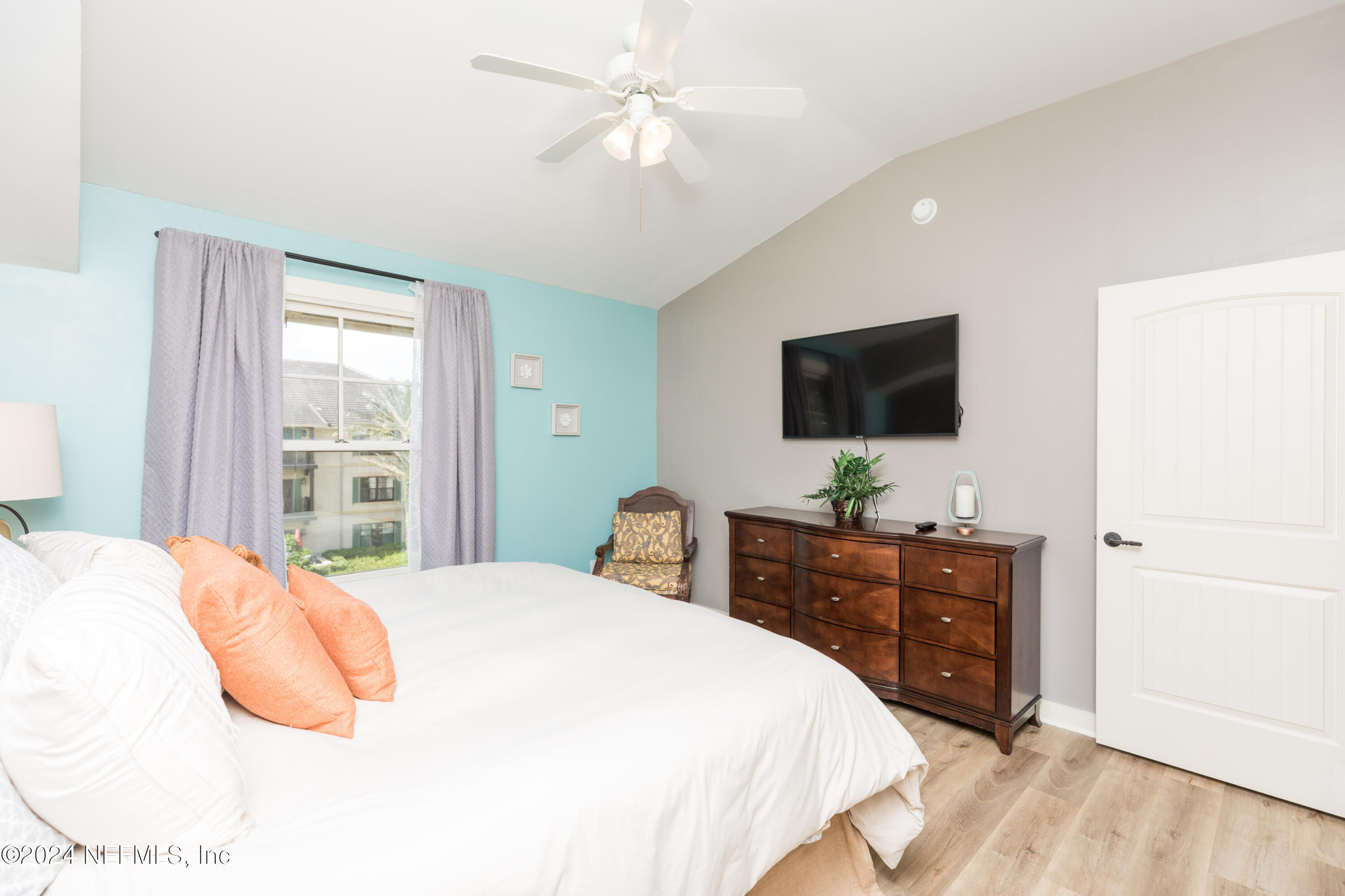 955 Registry Boulevard, Unit 308 St. Augustine, FL 32092 - Photo 21 of 55 a bedroom with a bed and a flat screen tv
