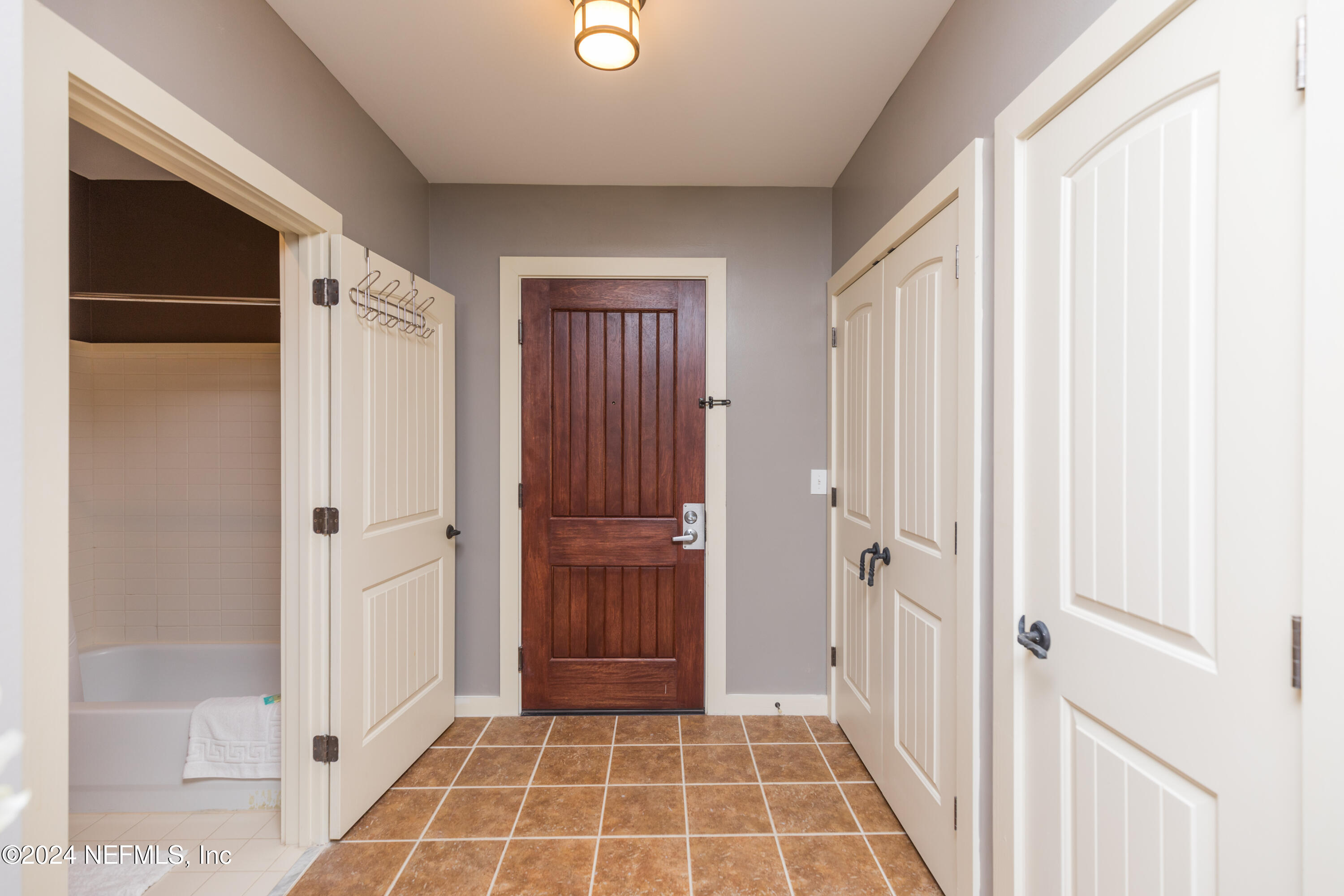955 Registry Boulevard, Unit 308 St. Augustine, FL 32092 - Photo 28 of 55 a view of a hallway with wooden floor and closet area