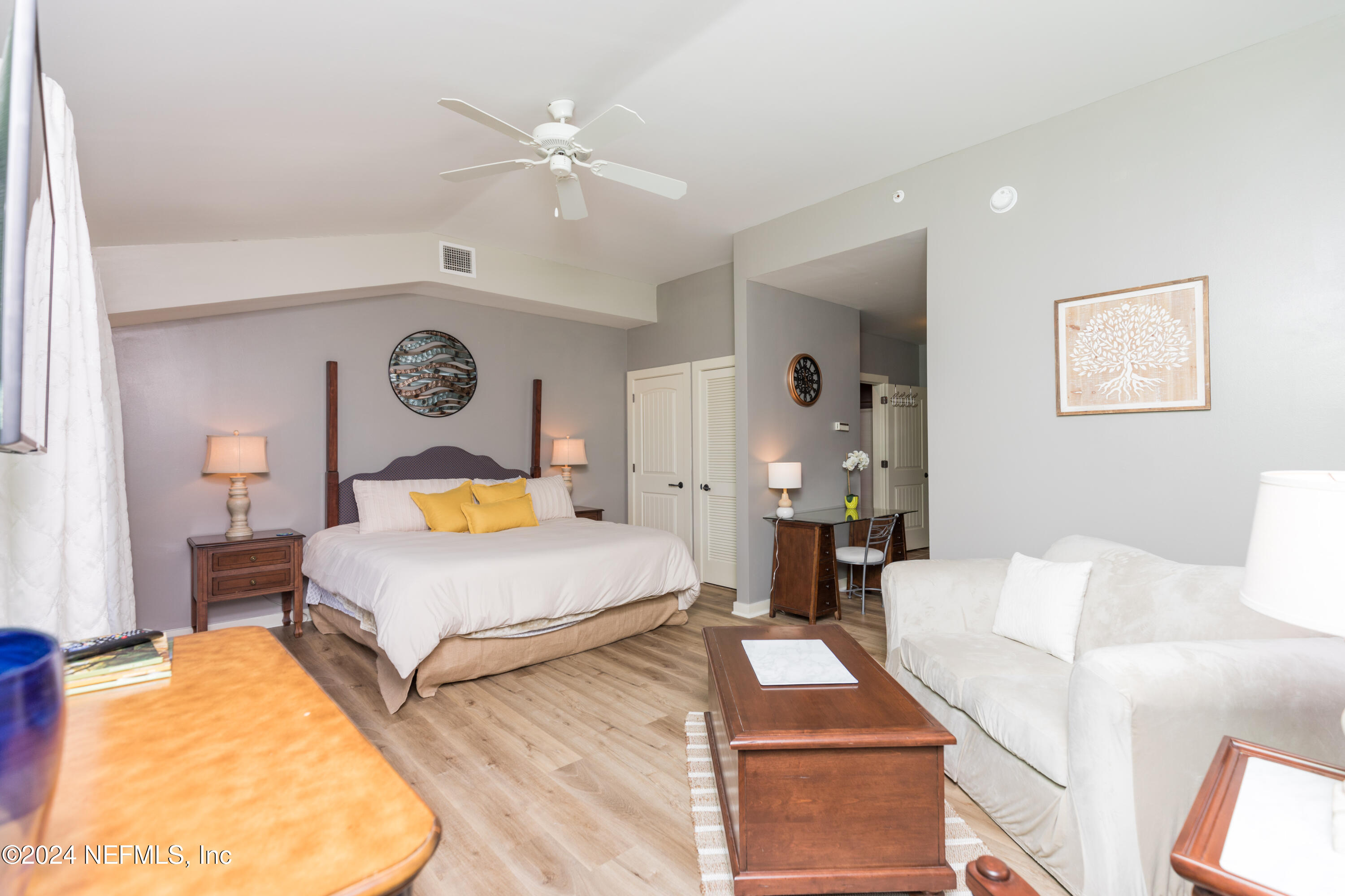 955 Registry Boulevard, Unit 308 St. Augustine, FL 32092 - Photo 33 of 55 a bedroom with two beds and painting on the wall