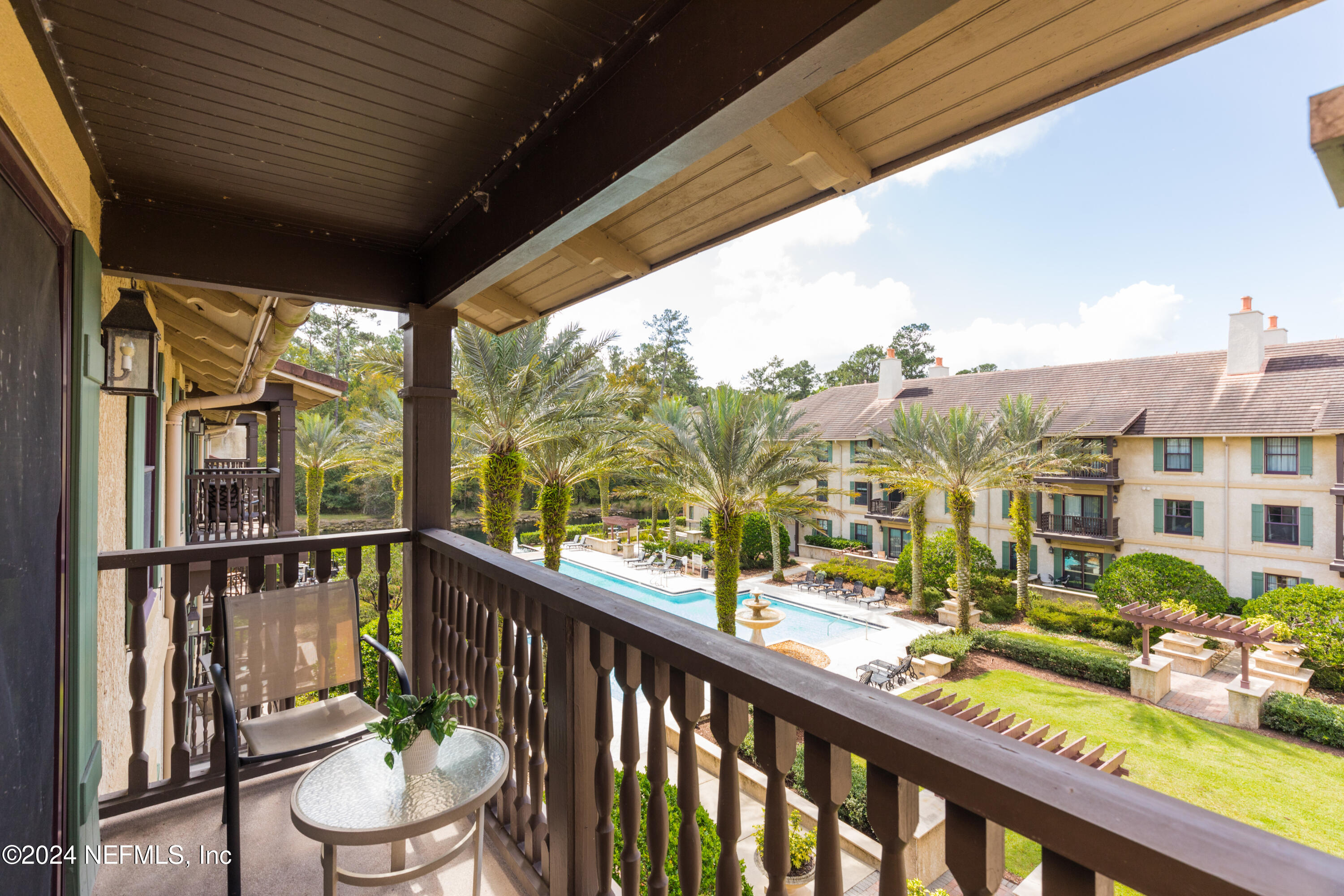 955 Registry Boulevard, Unit 308 St. Augustine, FL 32092 - Photo 38 of 55 a view of a blue chair and table in the balcony