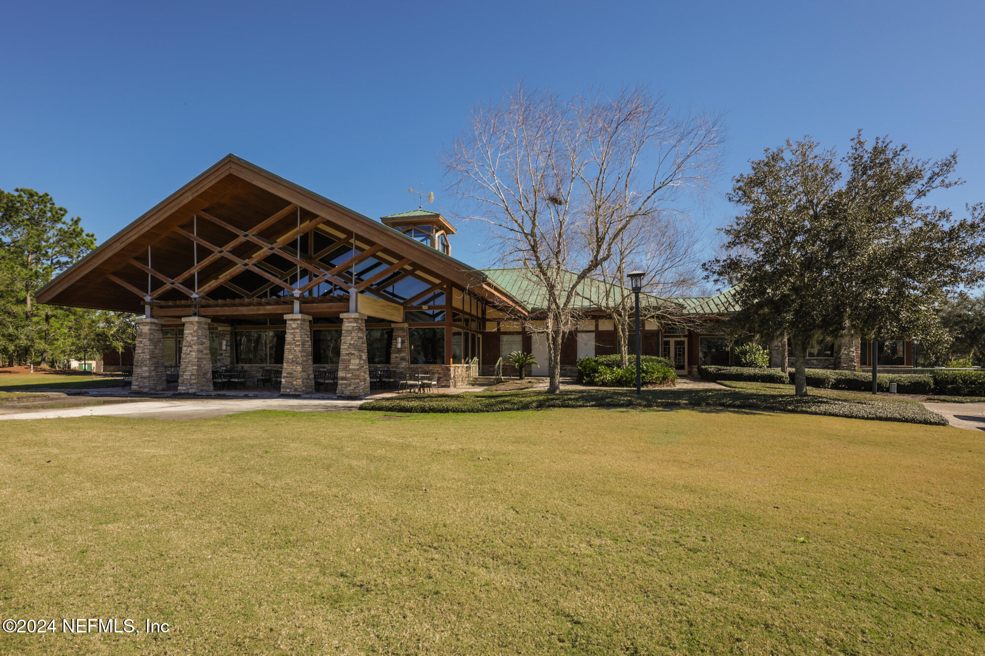955 Registry Boulevard, Unit 308 St. Augustine, FL 32092 - Photo 48 of 55 a view of a house with pool and trees in the background