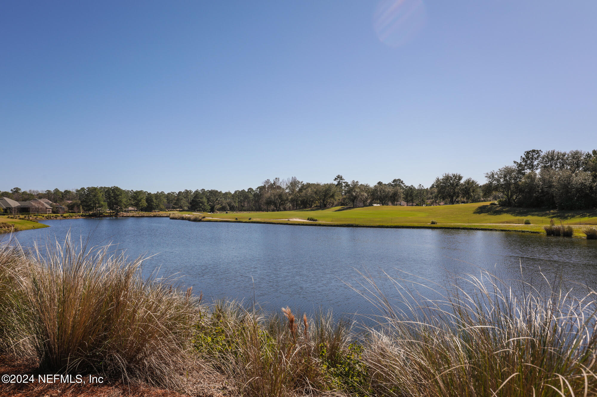 955 Registry Boulevard, Unit 308 St. Augustine, FL 32092 - Photo 55 of 55 a view of a lake with houses in the background