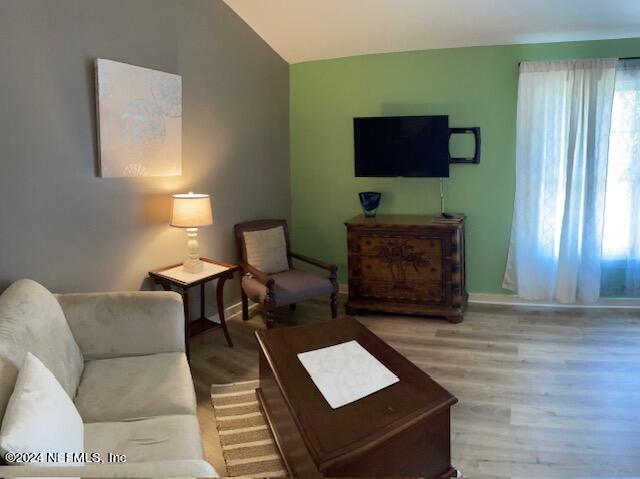 955 Registry Boulevard, Unit 308 St. Augustine, FL 32092 - Photo 8 of 55 a living room with furniture and a flat screen tv