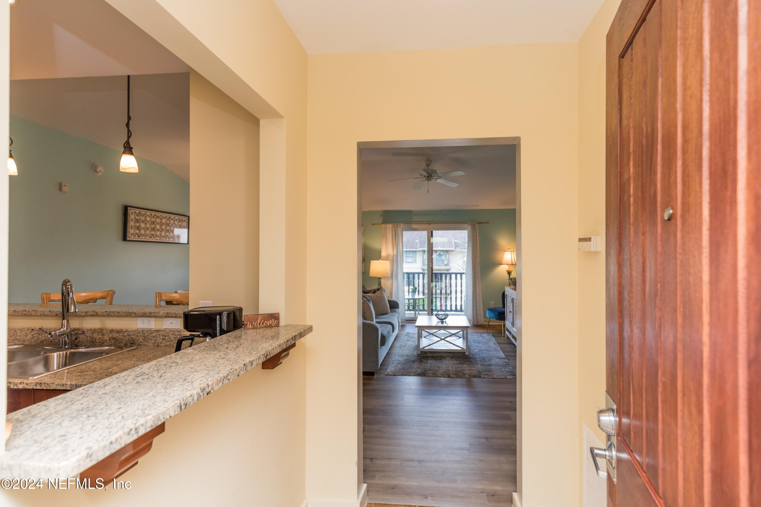955 Registry Boulevard, Unit 308 St. Augustine, FL 32092 - Photo 10 of 55 a living room with furniture and a large window