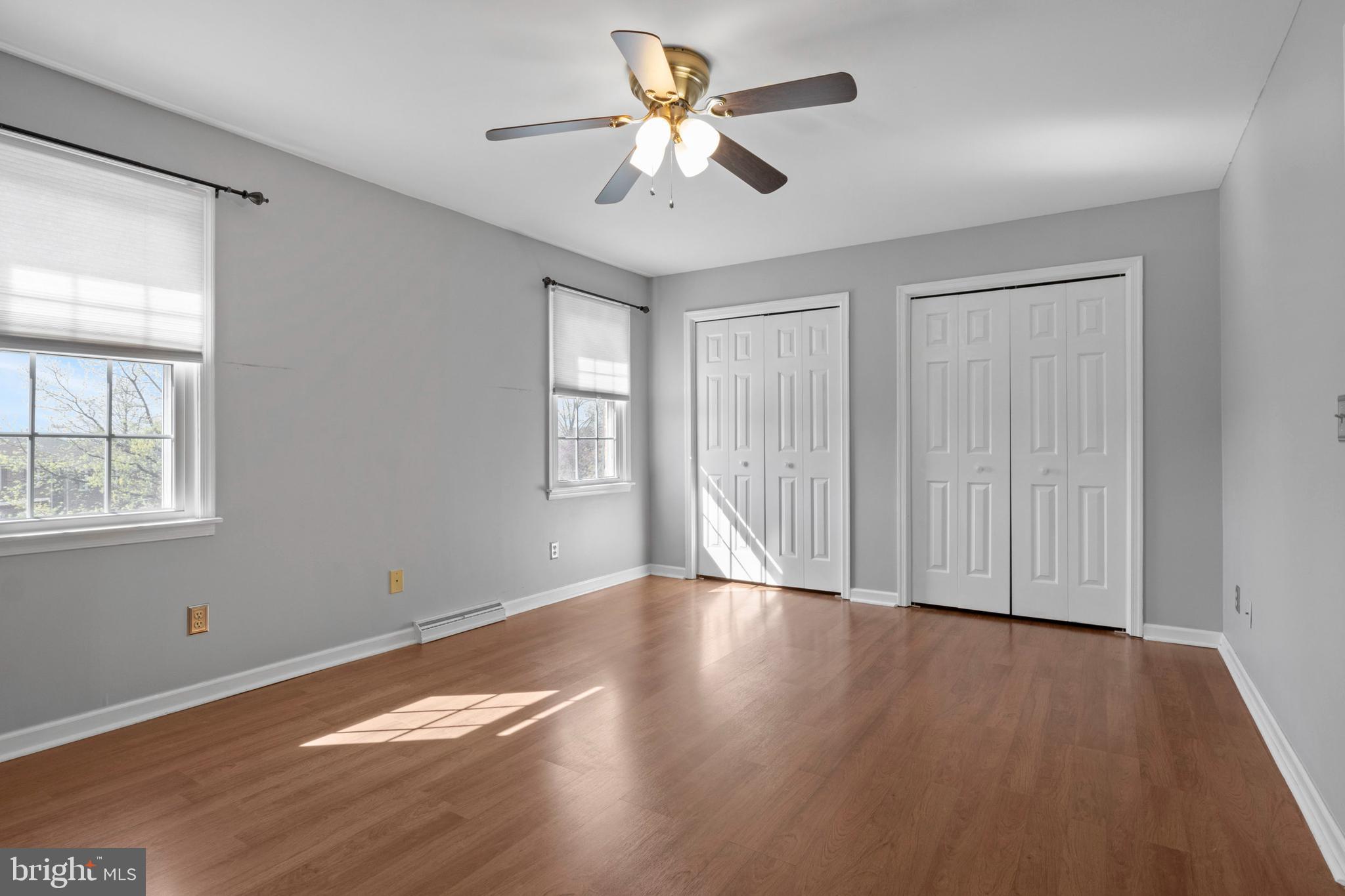 503 Chambers Ridge York, PA 17402 - Photo 18 of 34 an empty room with wooden floor chandelier fan and windows