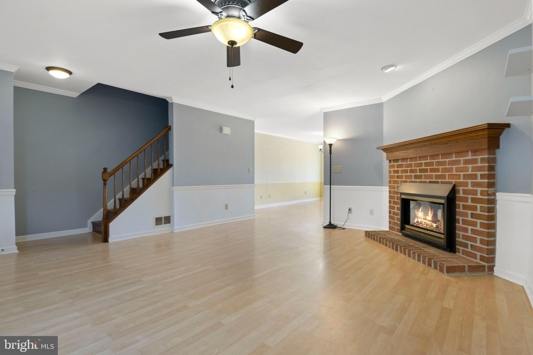 503 Chambers Ridge York, PA 17402 - Photo 5 of 34 a view of an empty room with wooden floor fireplace and a window