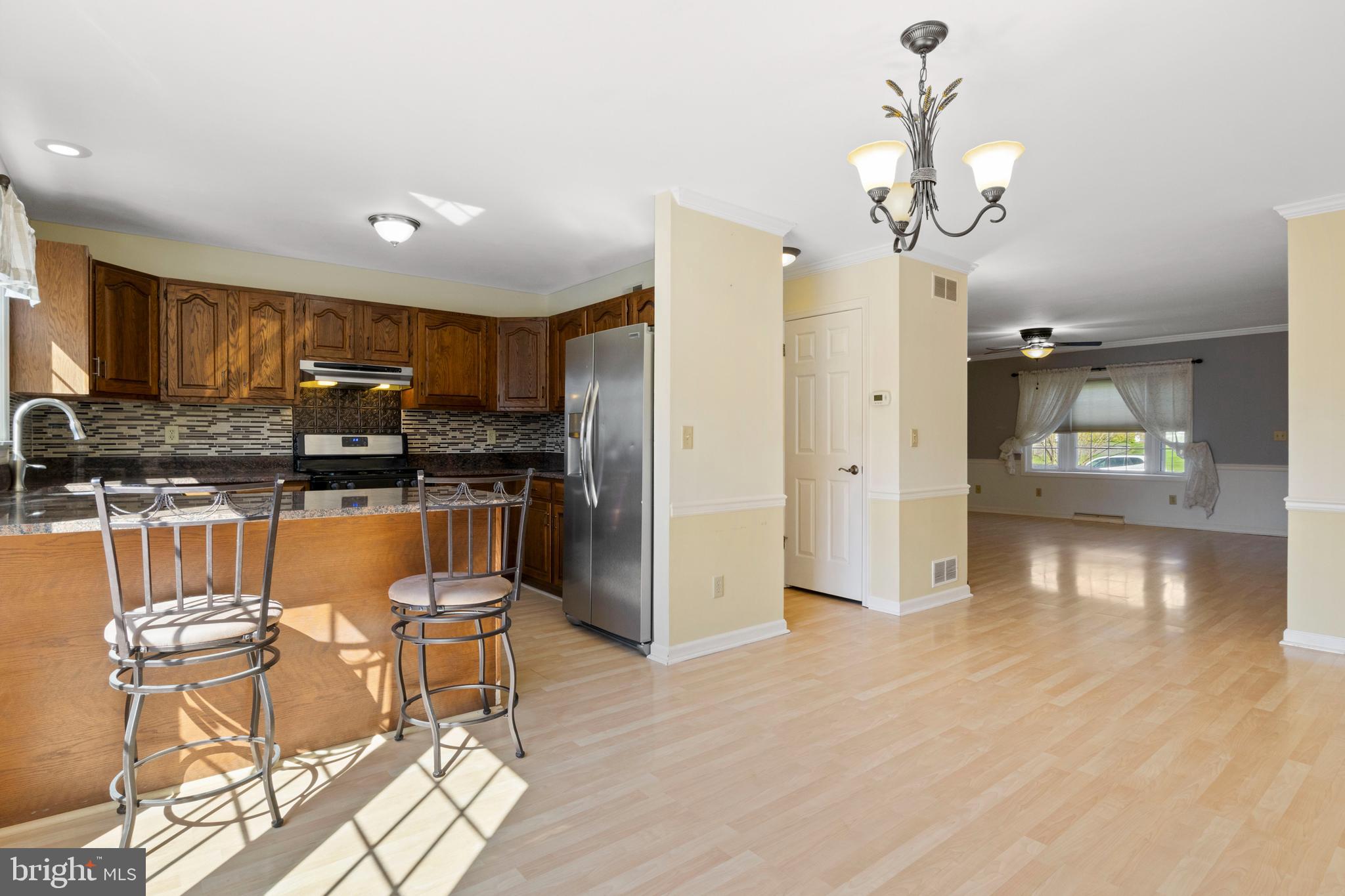 503 Chambers Ridge York, PA 17402 - Photo 7 of 34 a view of a kitchen with granite countertop stainless steel appliances cabinets and a counter top space