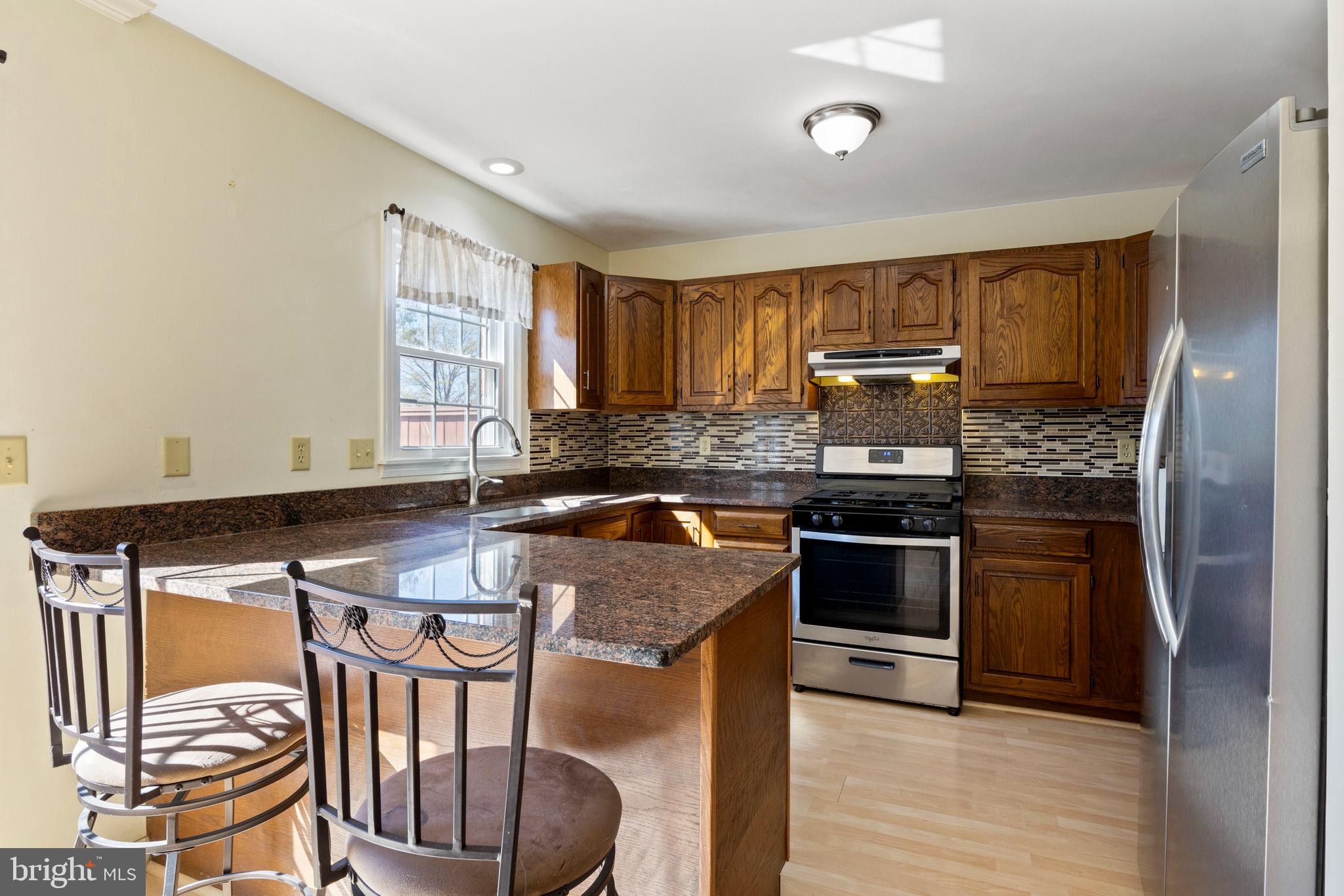 503 Chambers Ridge York, PA 17402 - Photo 8 of 34 a kitchen with stainless steel appliances granite countertop a stove a sink and a refrigerator