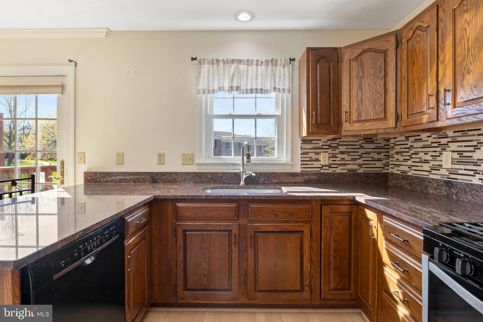 503 Chambers Ridge York, PA 17402 - Photo 9 of 34 a kitchen with granite countertop a sink and a window