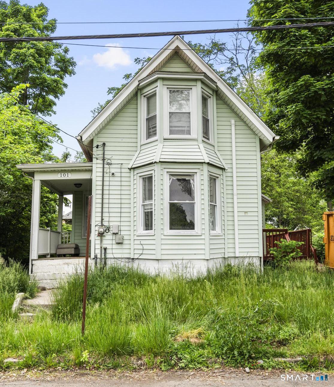 101 Meridian Street Meriden, CT 06451 - Photo 1 of 26 a front view of a house with a yard