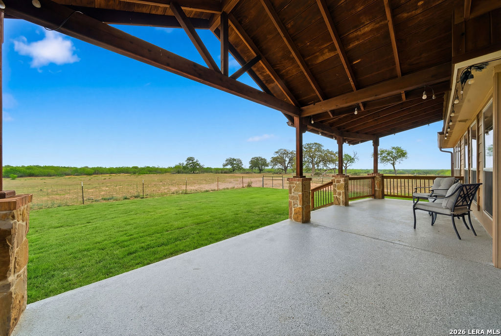 12897 La Vernia Road St. Hedwig, TX 78152 - Photo 4 of 34 a view of a yard with a table and chairs