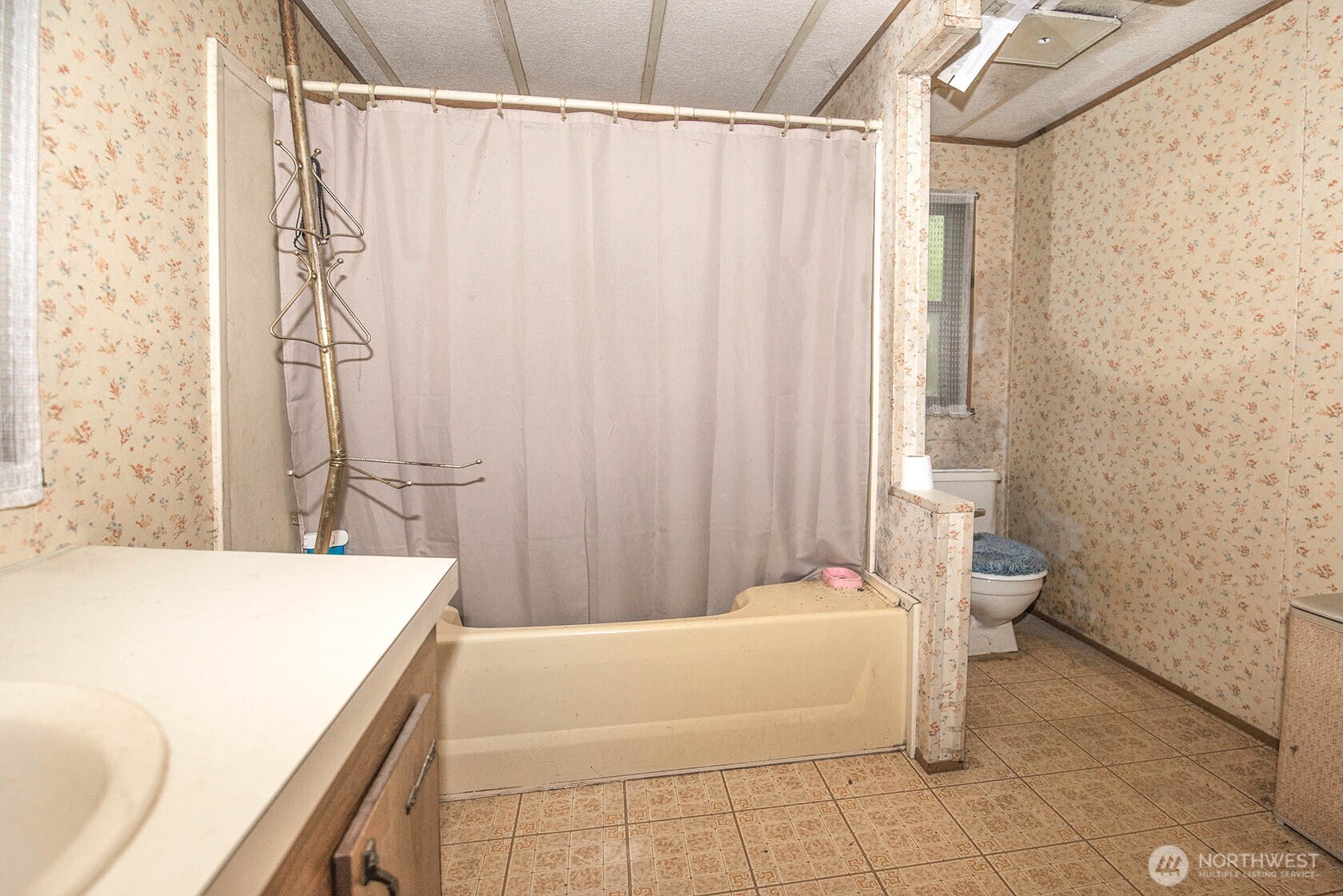 20115 49th Drive Southeast Bothell, WA 98012 - Photo 25 of 35 a bathroom with a sink a toilet and shower curtain