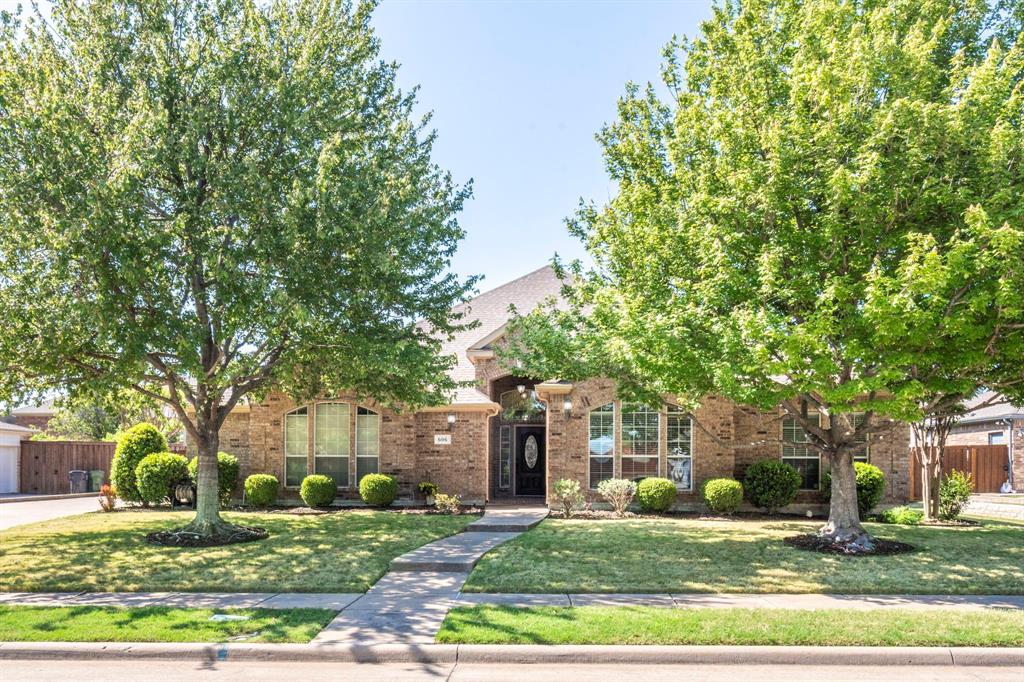 606 Lone Ridge Way Murphy, TX 75094 - Photo 1 of 1 front view of a house with a yard