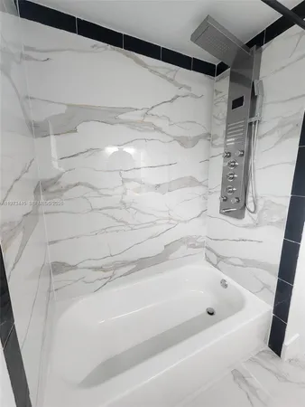 a bathroom with a sink toilet and mirror