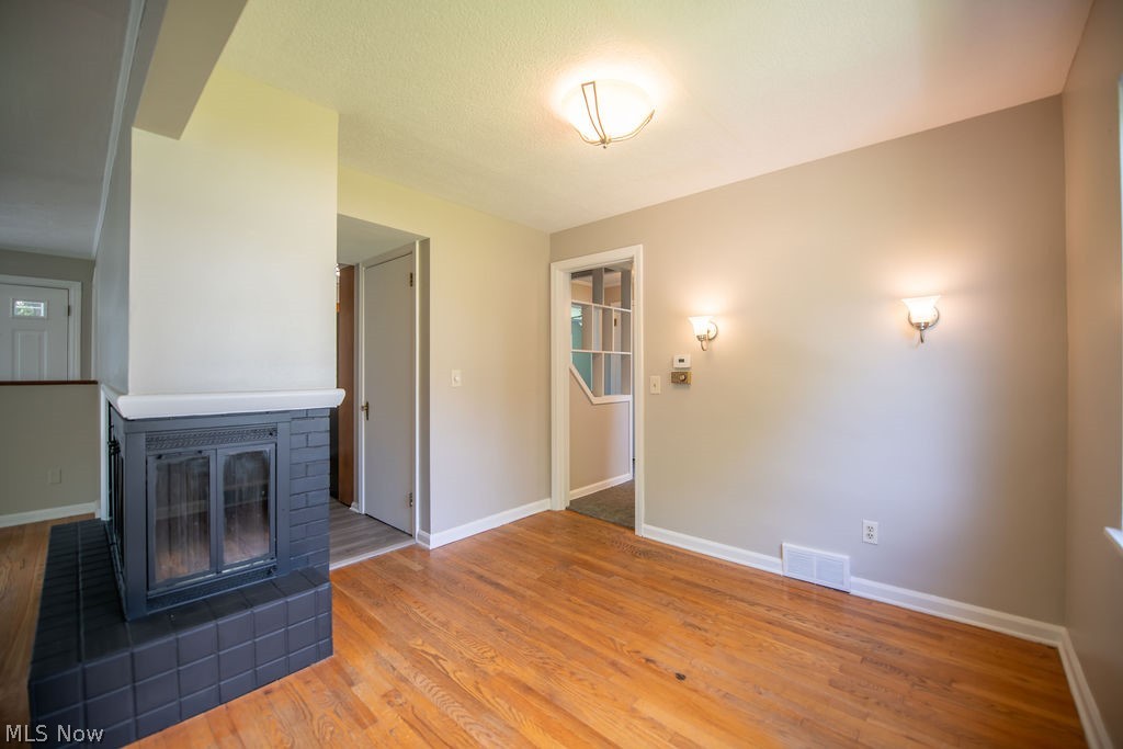 4221 2nd Street Northwest Canton, OH 44708 - Photo 10 of 35 Fireplace with dining area