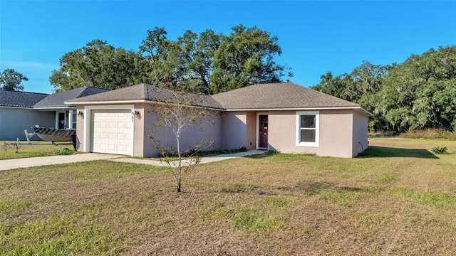 a house with trees in the background