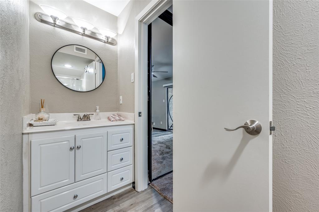 4517 North O'Connor Road, Unit 1138 Irving, TX 75062 - Photo 16 of 24 Bathroom with vanity and wood-type flooring