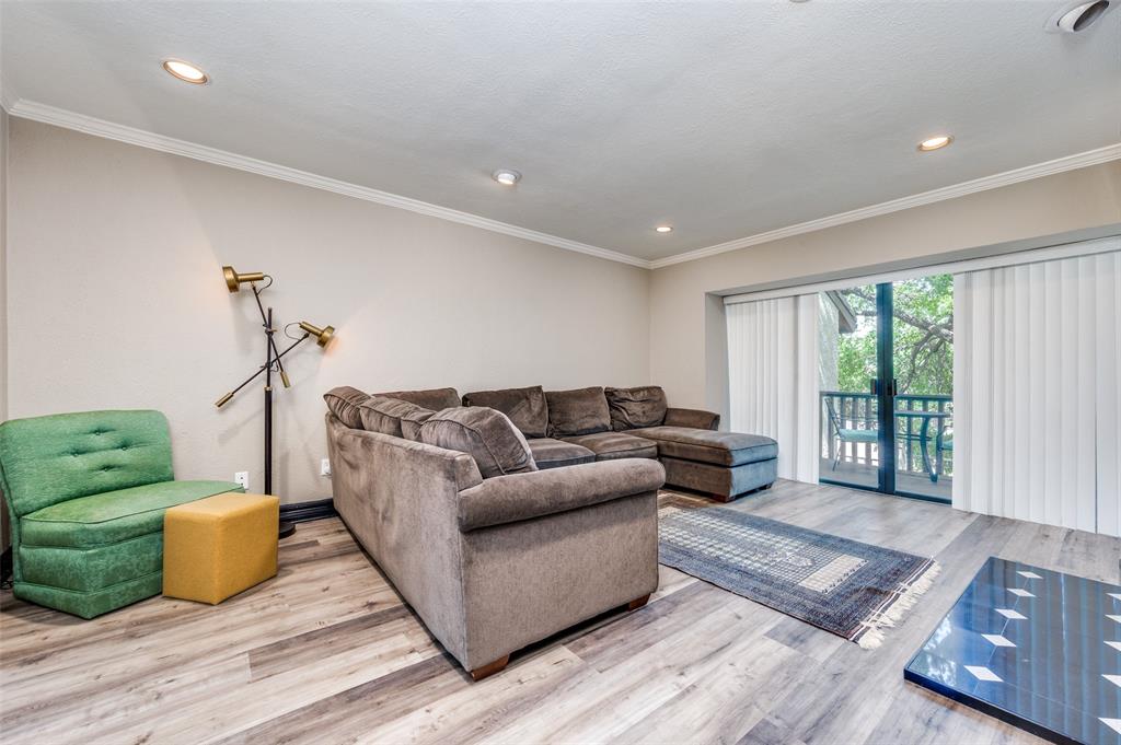 4517 North O'Connor Road, Unit 1138 Irving, TX 75062 - Photo 6 of 24 Living room featuring ornamental molding and hardwood / wood-style flooring