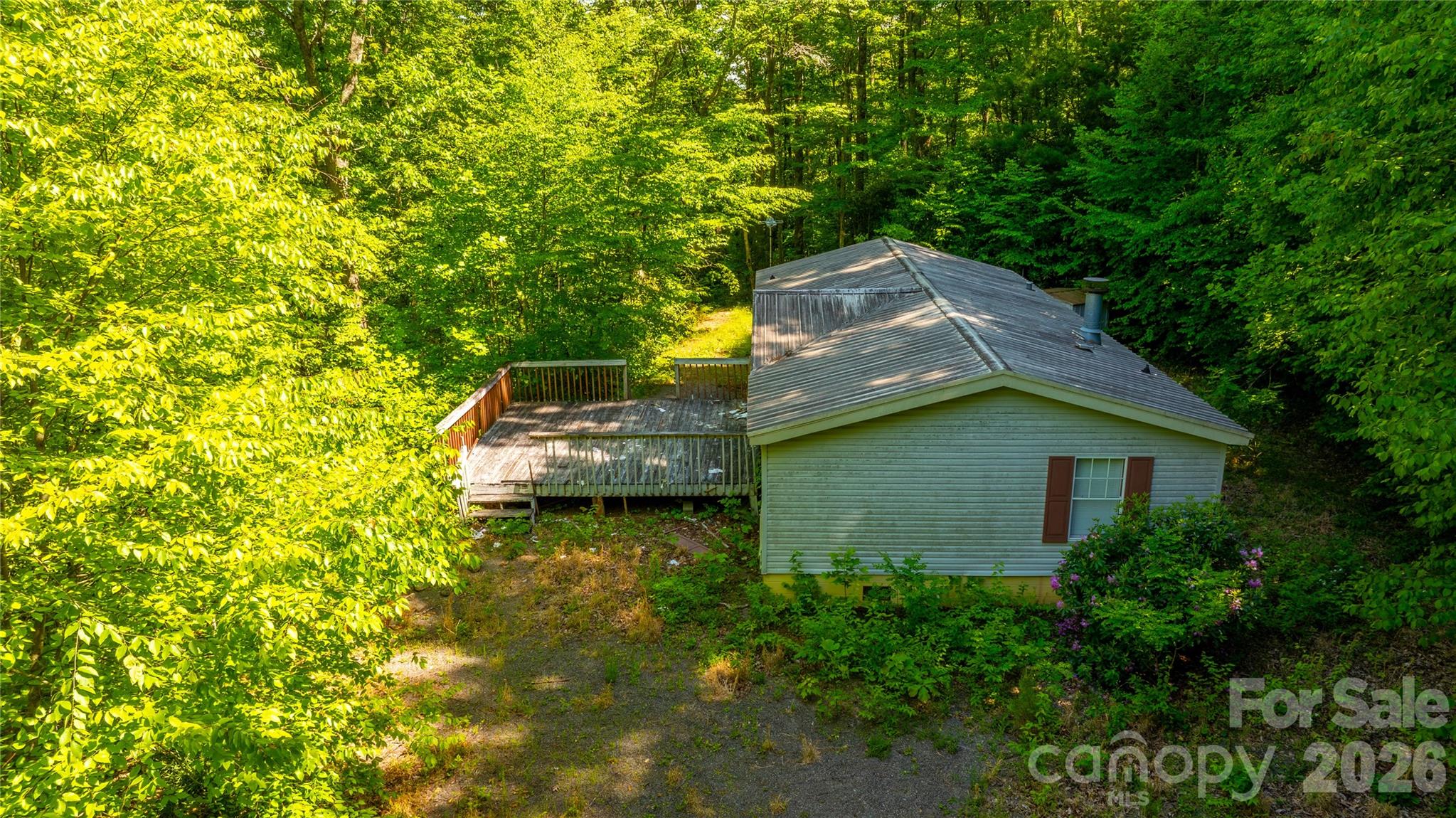 214 Ballard Creek Road Fairview, NC 28730 - Photo 2 of 18 a view of a house with a yard