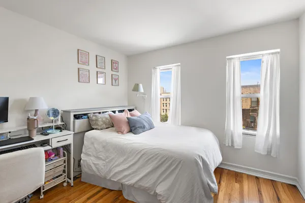 a bed room with a bed and a window