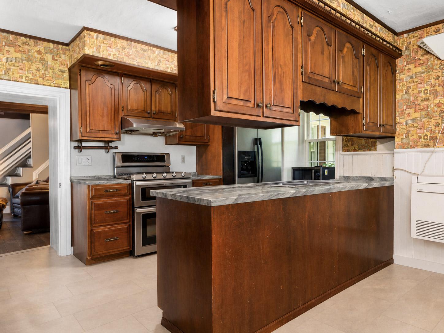 416 Snyder Road Reading, PA 19605 - Photo 24 of 65 a kitchen with stainless steel appliances granite countertop a refrigerator a stove and a sink