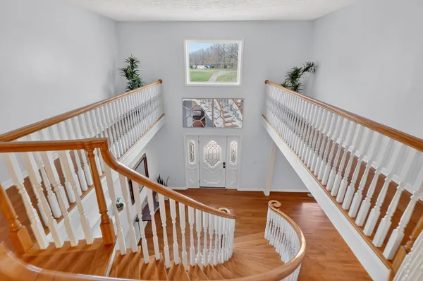 a view of an entryway with wooden floor