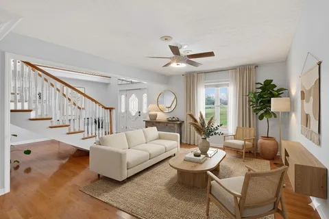 a view of an entryway with wooden floor