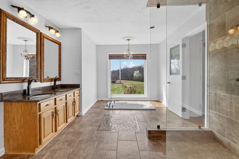 a kitchen with stainless steel appliances granite countertop a sink dishwasher and cabinets with wooden floor