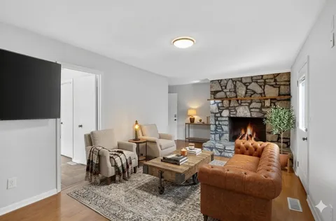 a kitchen with granite countertop kitchen island stainless steel appliances a table and chairs
