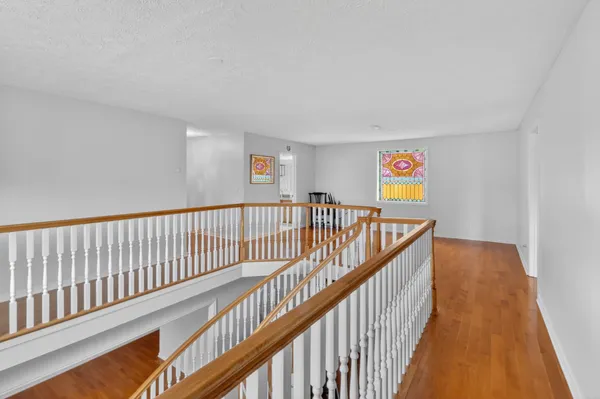 a living room with furniture ceiling fan and a rug
