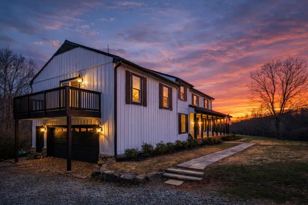 a view of a house with a backyard