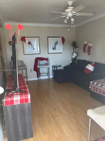 a bedroom with two beds and painting on the wall