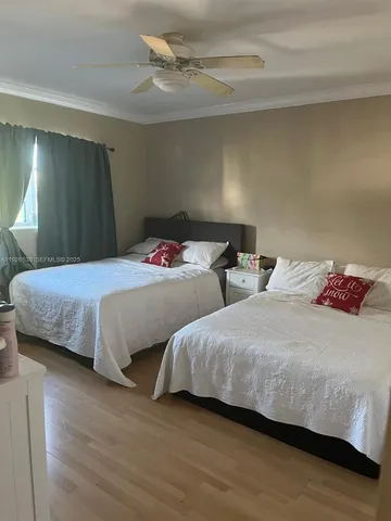 a bathroom with a sink and mirror with toilet