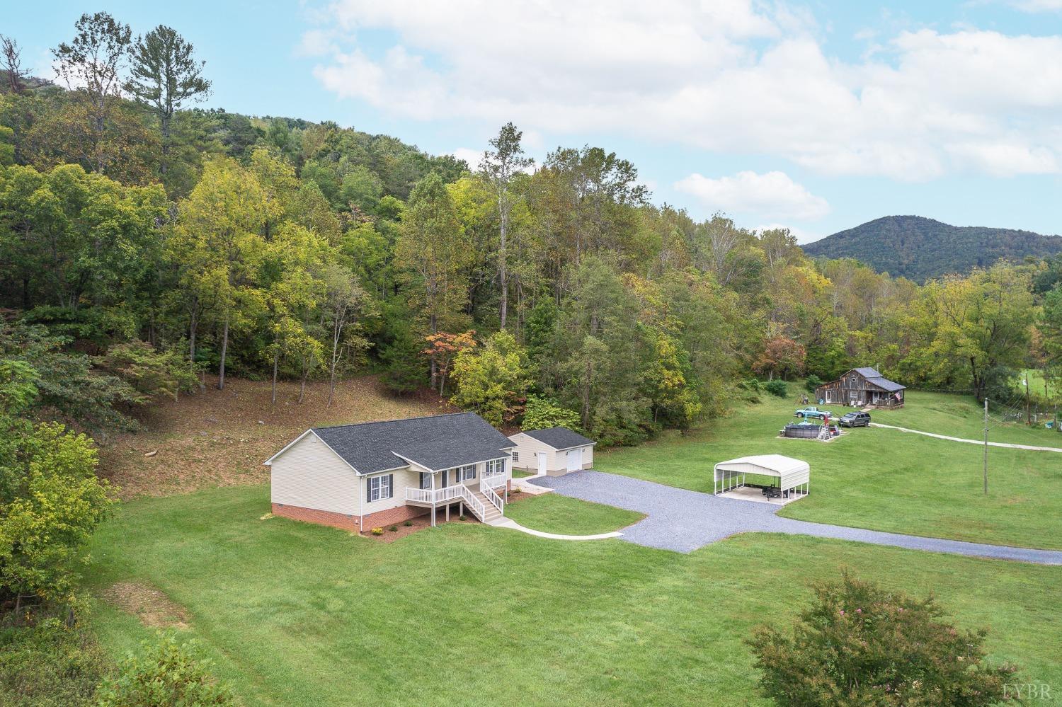617 North Fork Road Amherst, VA 24521 - Photo 3 of 62 a view of a house with a swimming pool and a yard