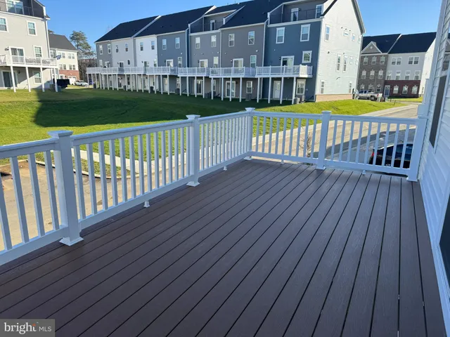 a view of a deck with a yard