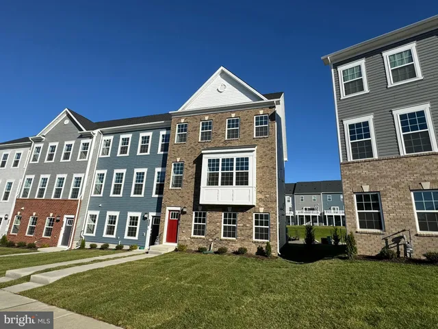 a front view of building with yard