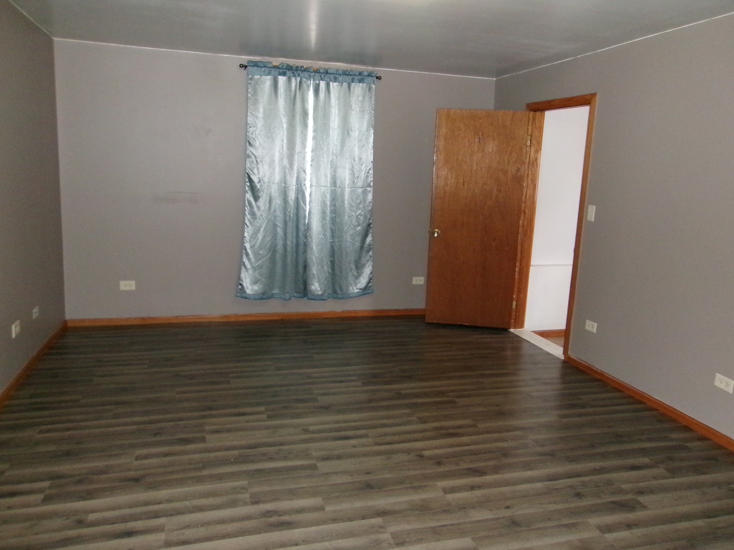 316 7th Street LaSalle, IL 61301 - Photo 2 of 11 a view of room with window and wooden floor