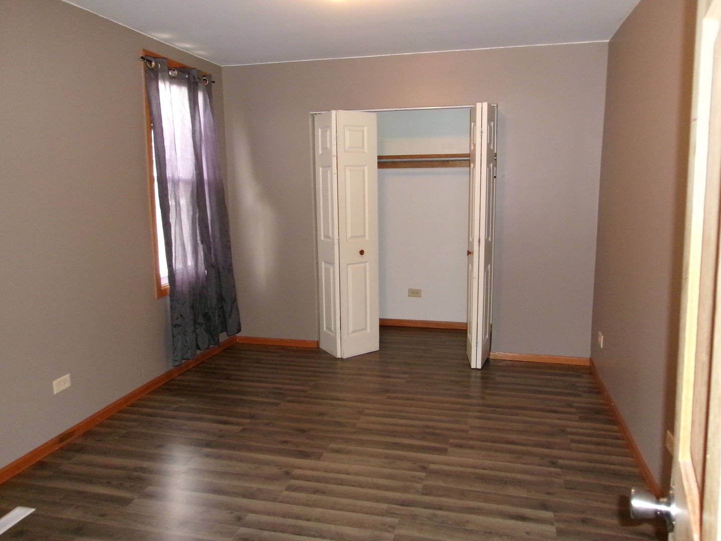 316 7th Street LaSalle, IL 61301 - Photo 5 of 11 a view of an empty room with wooden floor and a window
