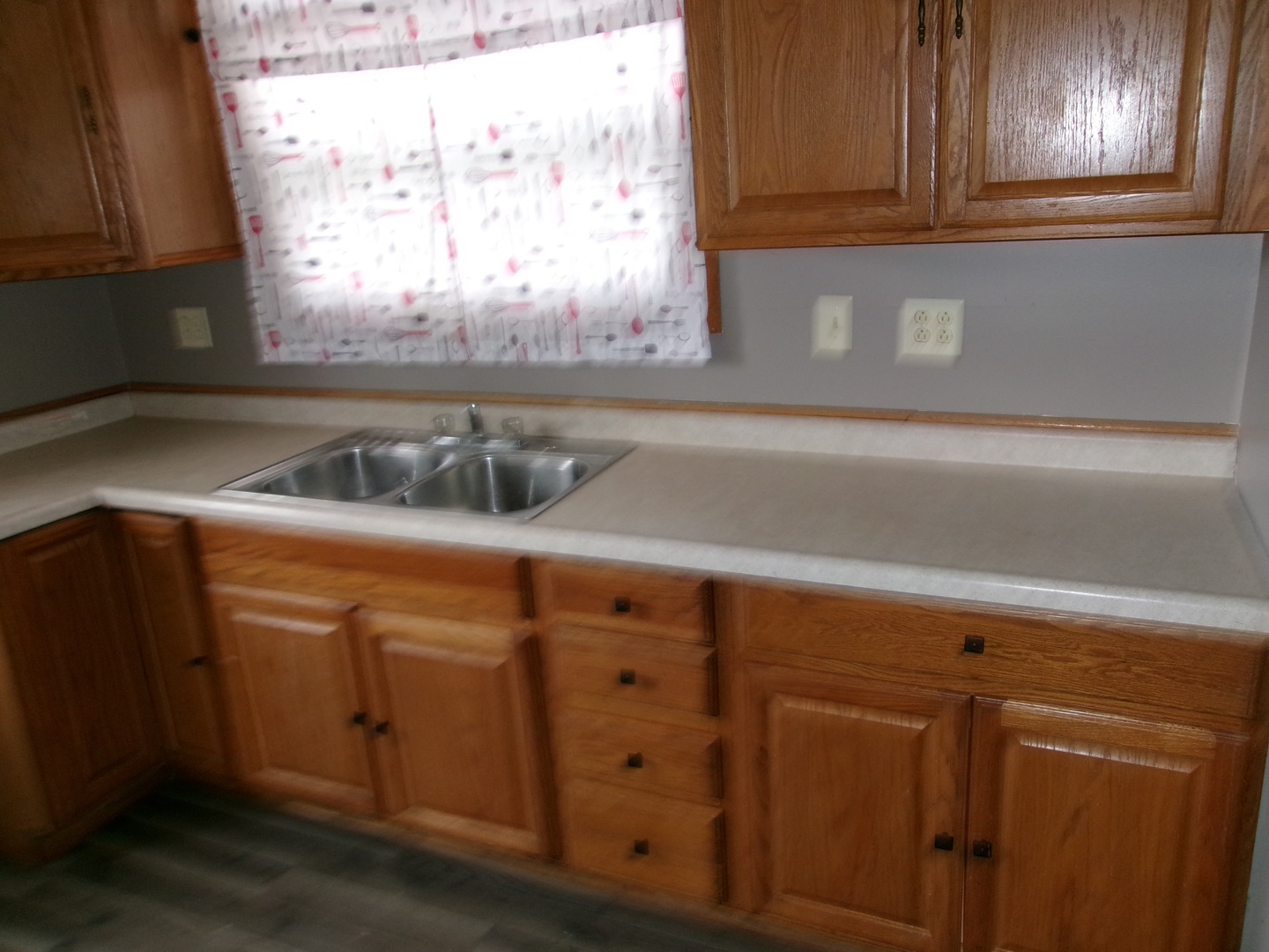 316 7th Street LaSalle, IL 61301 - Photo 7 of 11 a kitchen with a sink and cabinets