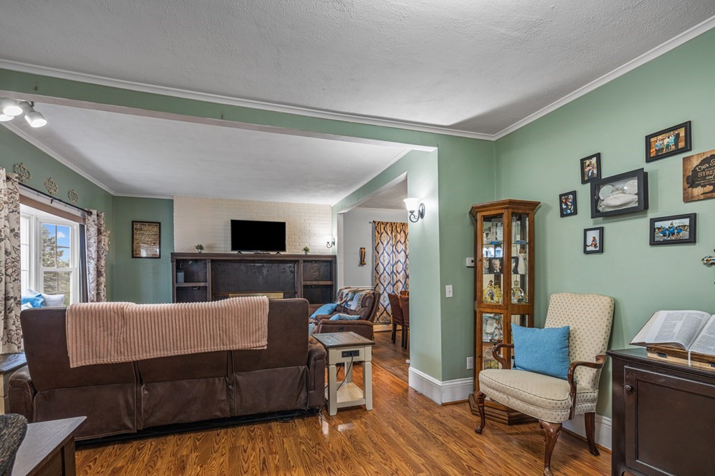 569 Gaskill Street Woonsocket, RI 02895 - Photo 12 of 33 a living room with furniture and a flat screen tv
