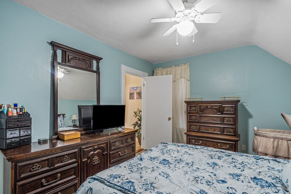 569 Gaskill Street Woonsocket, RI 02895 - Photo 17 of 33 a bedroom with a bed and a flat screen tv