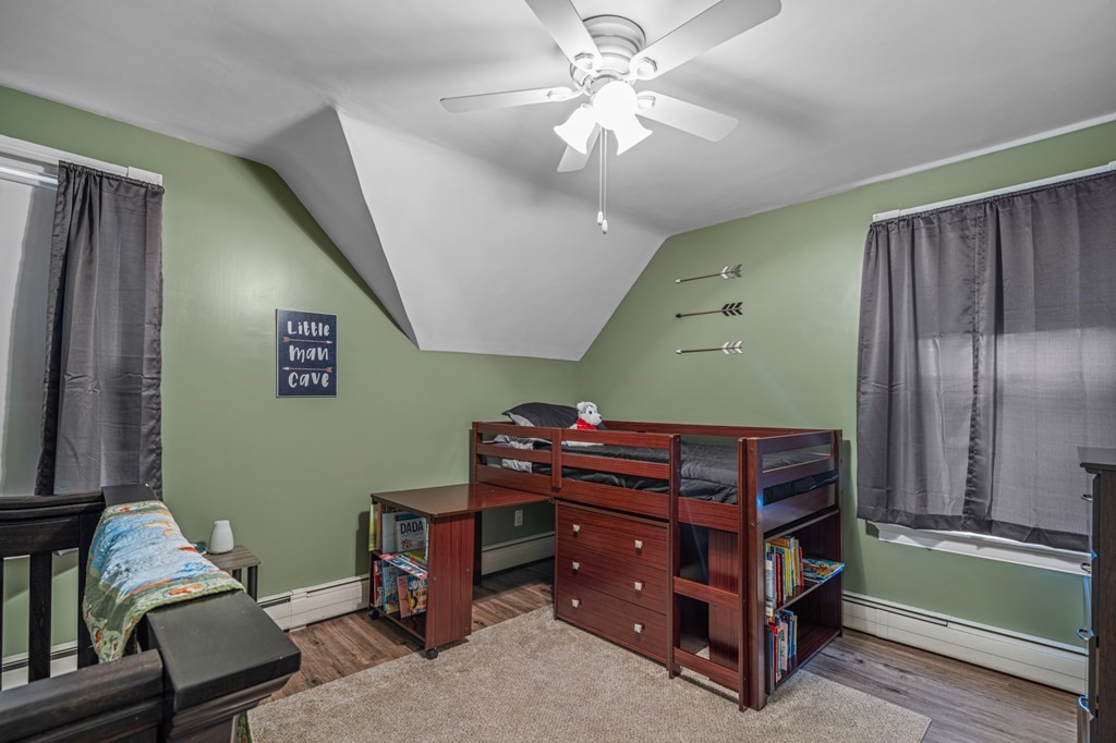569 Gaskill Street Woonsocket, RI 02895 - Photo 21 of 33 a room with furniture and a flat screen tv