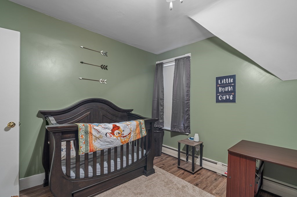 569 Gaskill Street Woonsocket, RI 02895 - Photo 22 of 33 a bedroom with a bed and a window