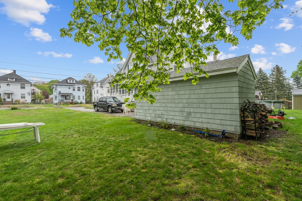 569 Gaskill Street Woonsocket, RI 02895 - Photo 29 of 33 a view of a garden with a house in the background