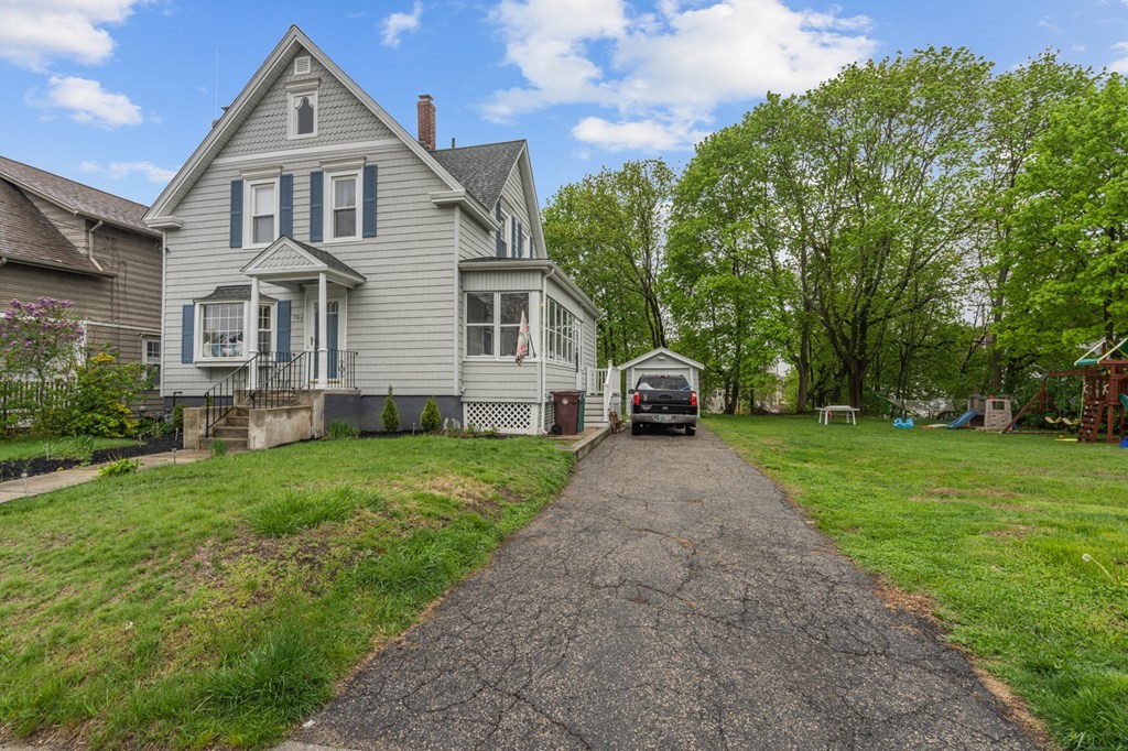 569 Gaskill Street Woonsocket, RI 02895 - Photo 33 of 33 a front view of a house with a yard