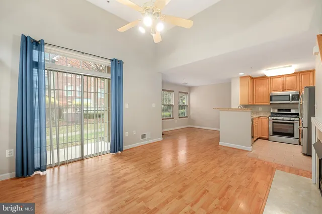 a view of a kitchen with a stove cabinets and a kitchen