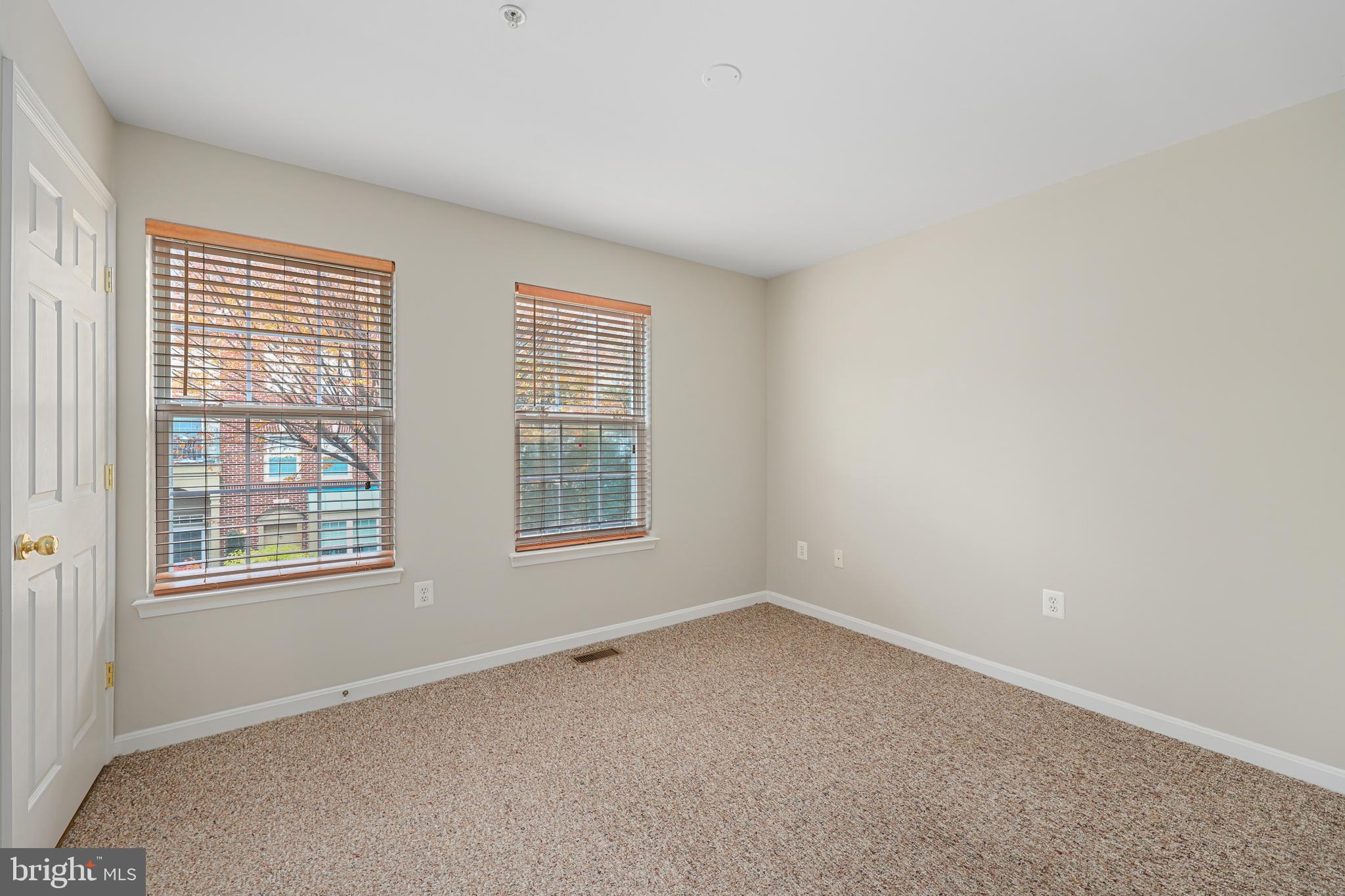 11824 Breton Court, Unit 24A Reston, VA 20191 - Photo 17 of 34 an empty room with a window