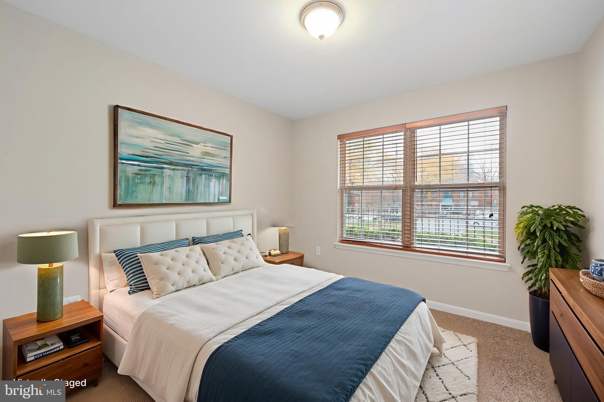 11824 Breton Court, Unit 24A Reston, VA 20191 - Photo 23 of 34 a bedroom with a bed and a large window