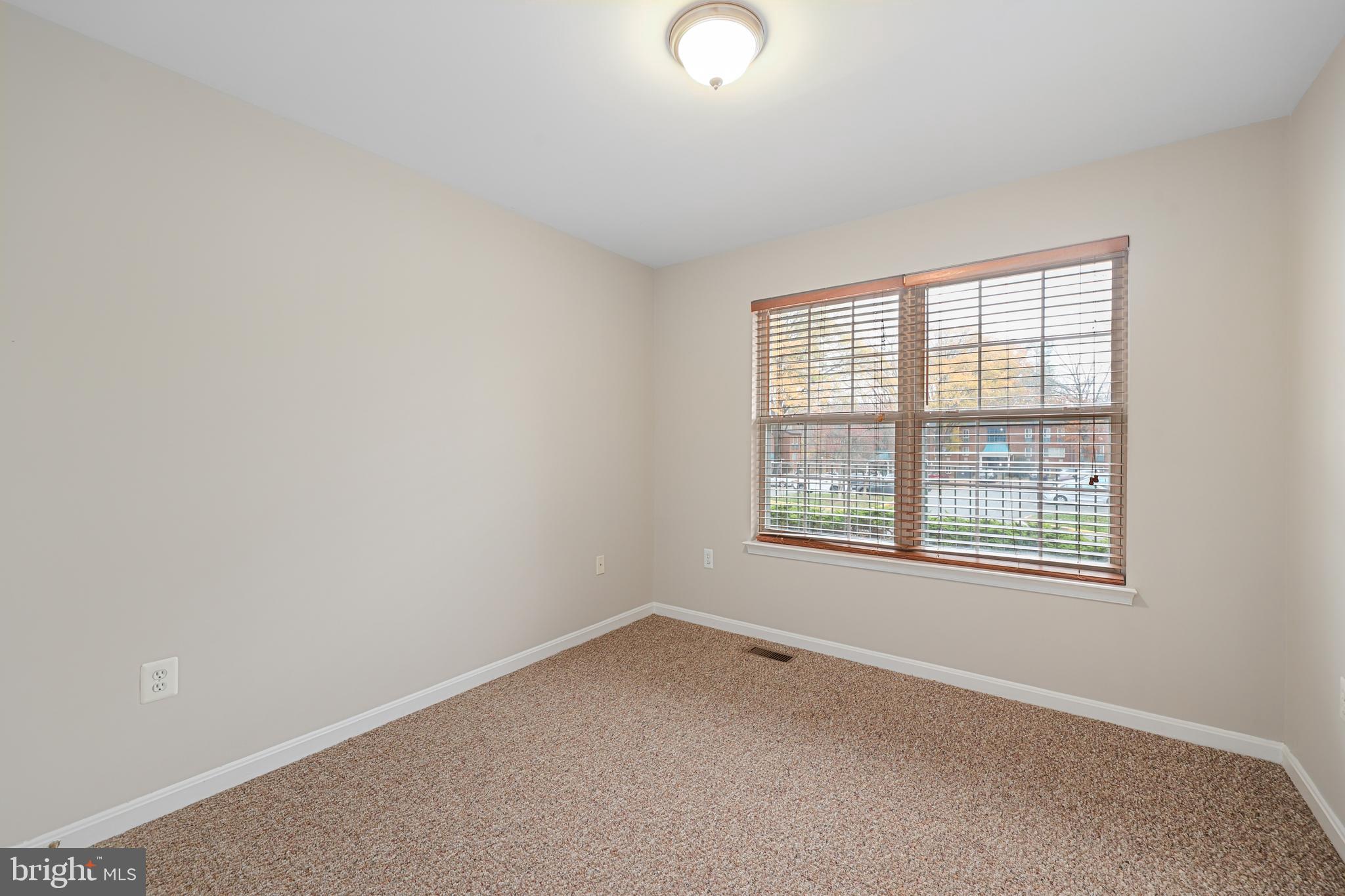 11824 Breton Court, Unit 24A Reston, VA 20191 - Photo 24 of 34 an empty room with a window